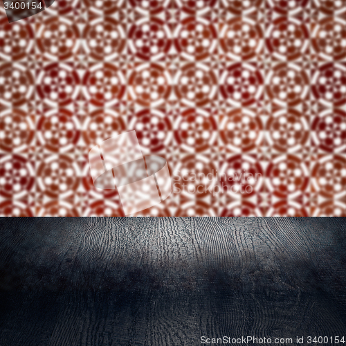 Image of Wood table top and blur vintage ceramic tile pattern wall