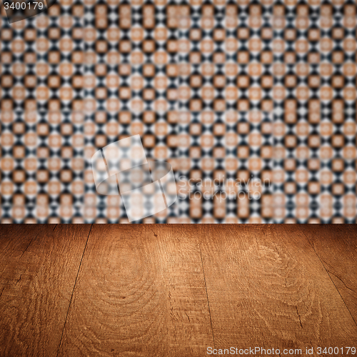 Image of Wood table top and blur vintage ceramic tile pattern wall