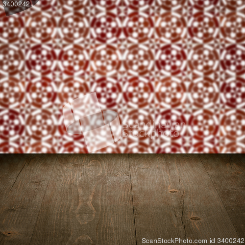 Image of Wood table top and blur vintage ceramic tile pattern wall