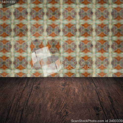 Image of Wood table top and blur vintage ceramic tile pattern wall