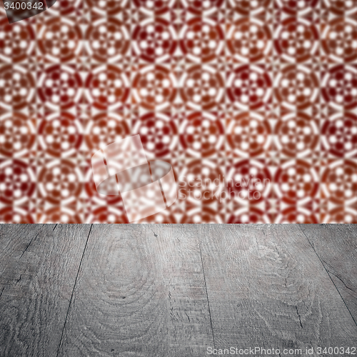 Image of Wood table top and blur vintage ceramic tile pattern wall