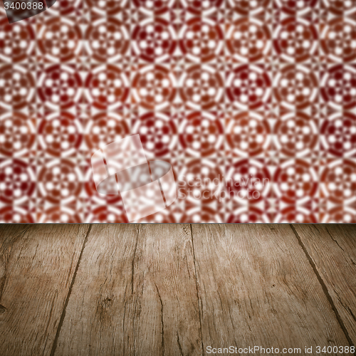 Image of Wood table top and blur vintage ceramic tile pattern wall