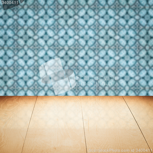 Image of Wood table top and blur vintage ceramic tile pattern wall