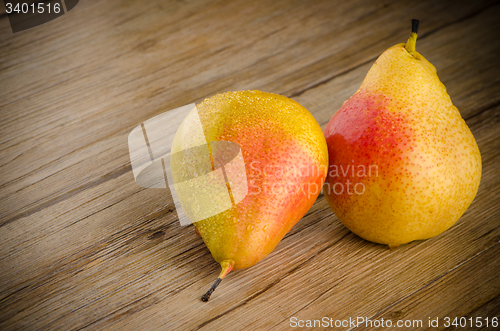 Image of Pears in a old wooden table