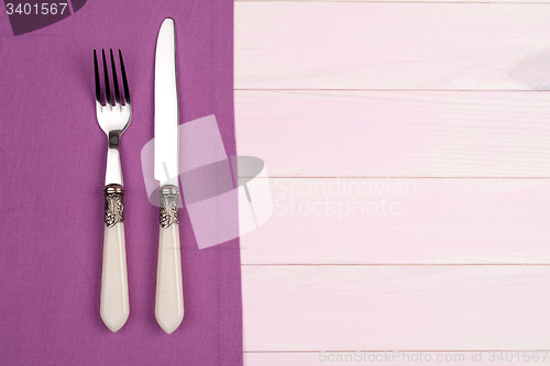 Image of Kitchenware on purple towel