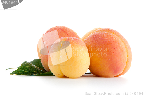 Image of Sweet peaches with leafs