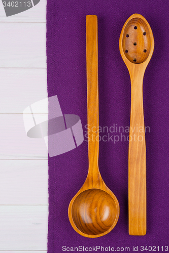 Image of Kitchenware on purple towel