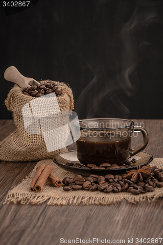 Image of Coffee cup with burlap sack