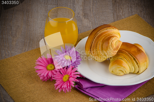 Image of Croissants with orange juice 