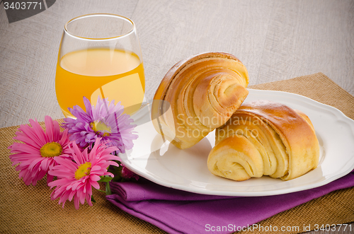 Image of Croissants with orange juice 