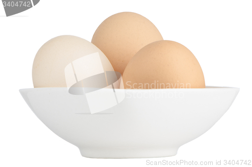 Image of Brown eggs in white ceramic bowl