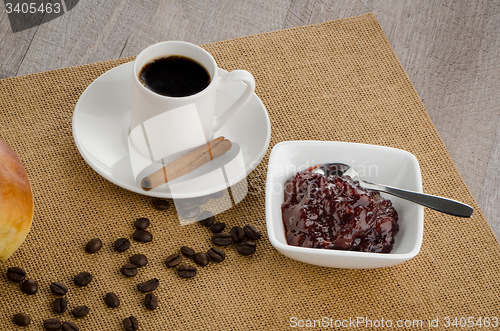 Image of Cup of black coffee and croissant 