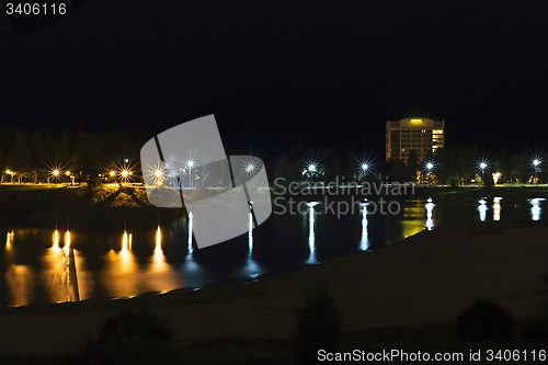 Image of Cityscape on riverside at night