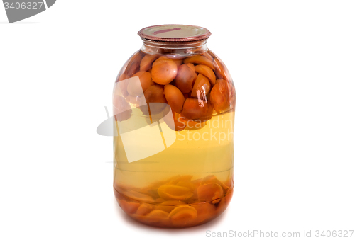 Image of Home canning: glass cylinders with apricot compote on white back