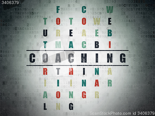 Image of Education concept: word Coaching in solving Crossword Puzzle