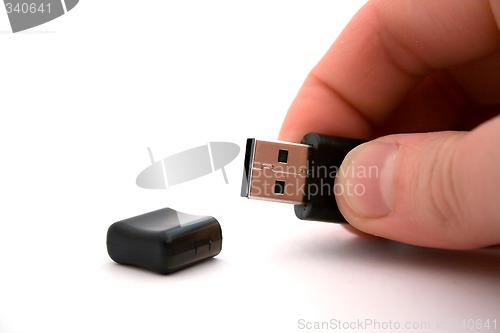 Image of usb storage in hand on a white background. isolated