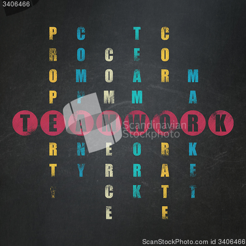 Image of Finance concept: word Teamwork in solving Crossword Puzzle
