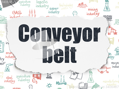 Image of Manufacuring concept: Conveyor Belt on Torn Paper background