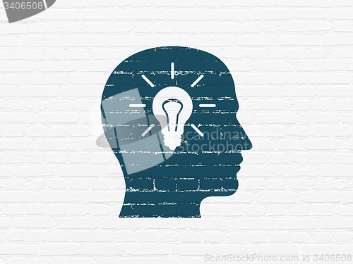 Image of Advertising concept: Head With Light Bulb on wall background