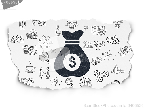 Image of Business concept: Money Bag on Torn Paper background