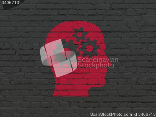 Image of Finance concept: Head With Gears on wall background