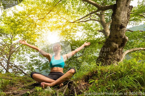 Image of Woman relaxing in beautiful nature.