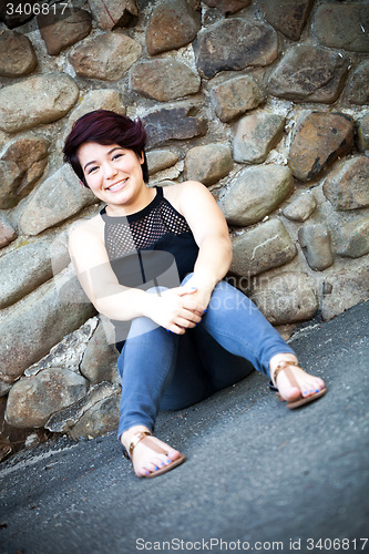 Image of Smiling Brunette Woman Sitting