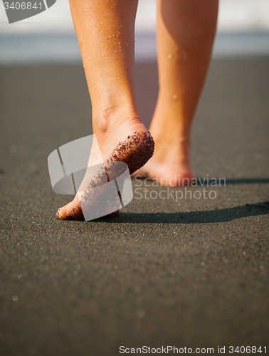 Image of Wet, Black Sand on a Tourist\'s Foot at a Tropical Beach. Bali, I