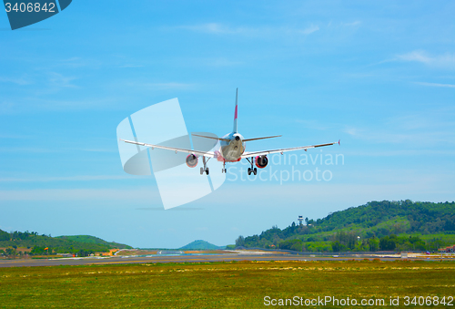 Image of Twin-engine, modern, commercial airliner coming for a landing at