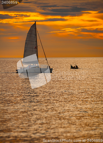 Image of Catamaran Sailboat on a Tropical Sea at Sunset