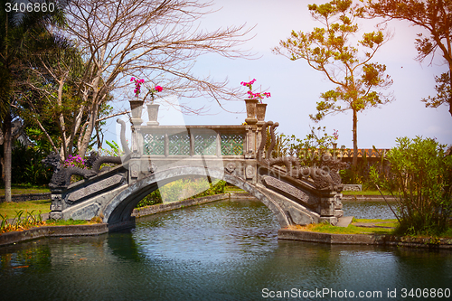 Image of Ornate Bridge with Dragon Motif at Tirta Gangga in Indonesia