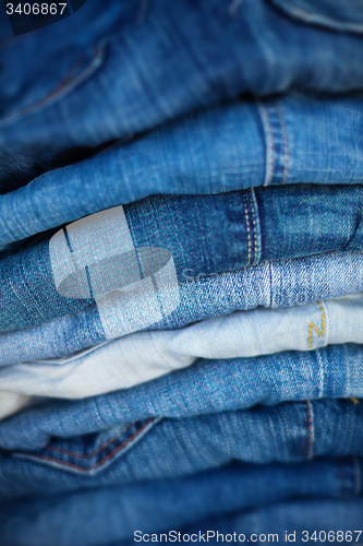 Image of Jeans in Assorted Shades of Blue, Folded and On Display