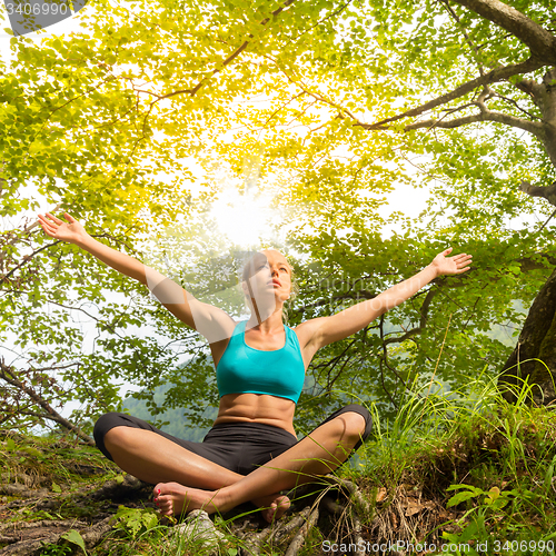 Image of Woman relaxing in beautiful nature.