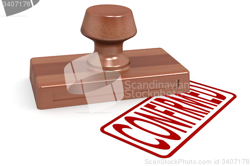 Image of Wooden stamp confirmed with red text