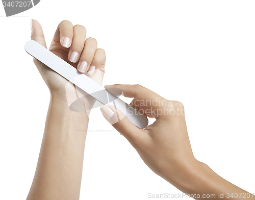 Image of Woman cares for her fingernails