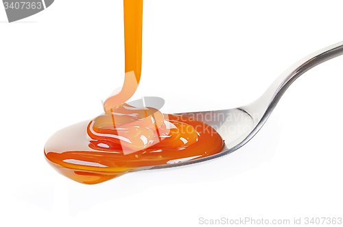 Image of spoon of caramel sauce