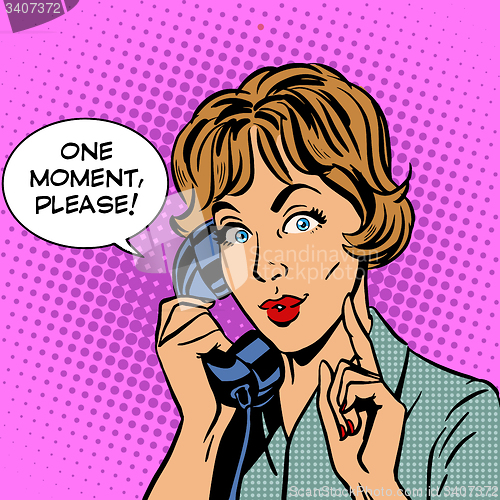 Image of One moment please woman speaks phone