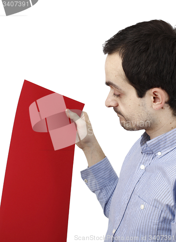 Image of Man holding a paper