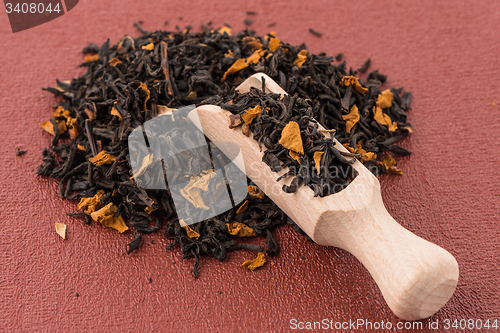 Image of Black Dry Tea with a Wooden Spoon