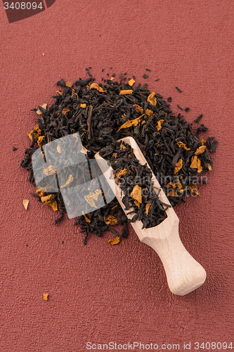 Image of Black Dry Tea with a Wooden Spoon