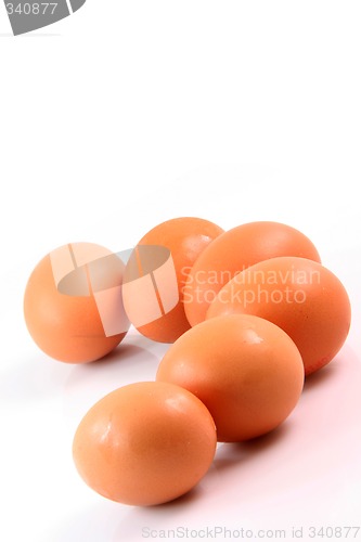 Image of six brown eggs