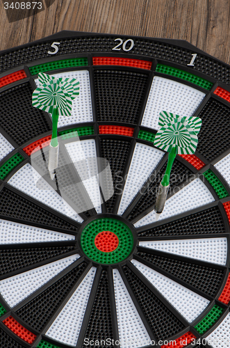 Image of Dart board with darts