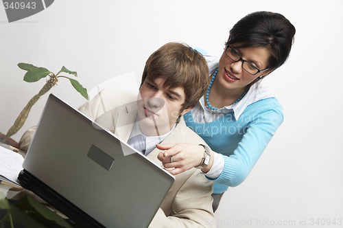 Image of beautiful caucasian business woman with young consultant