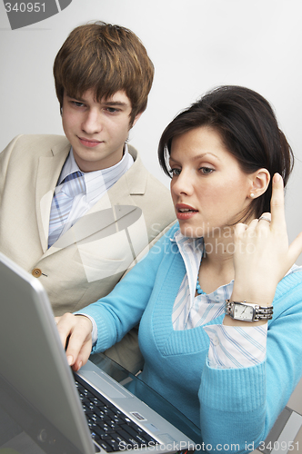 Image of beautiful caucasian business woman with young consultant