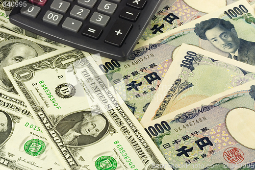 Image of Forex - US and Japanese currency pair with calculator

