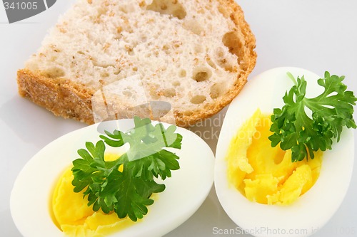 Image of Cooked eggs decorated with parsley