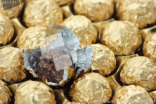 Image of Chocolate sweets in golden foil