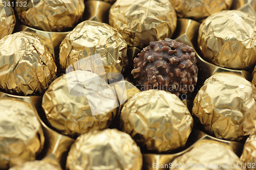 Image of Chocolate sweets in golden foil