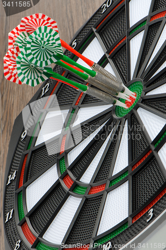 Image of Dart board with darts