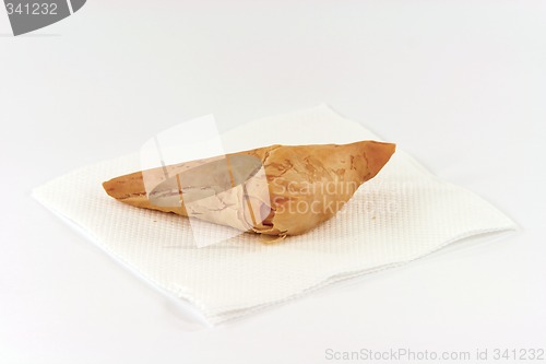 Image of one cheese pie on napkin